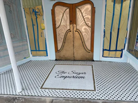 Custom mosaic logo at the entrance