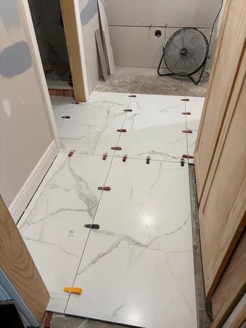 Floor tile with leveling system in the hallway