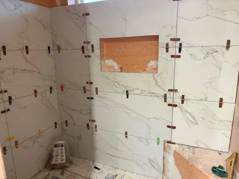 Setting tile around the niche