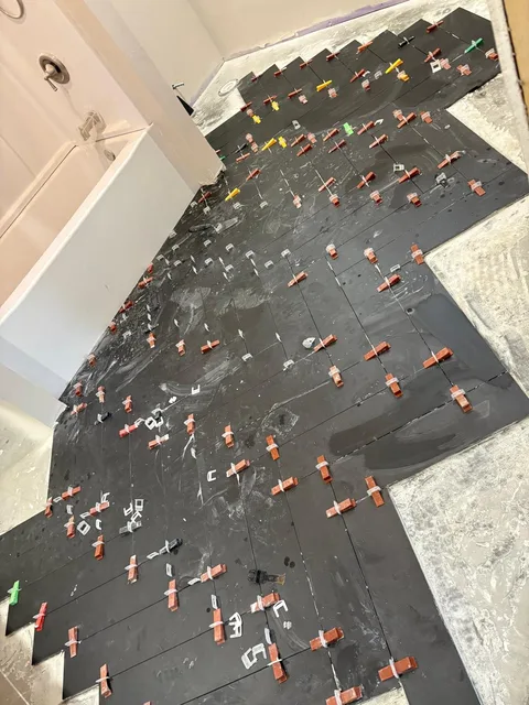 Black floor tile with leveling clips