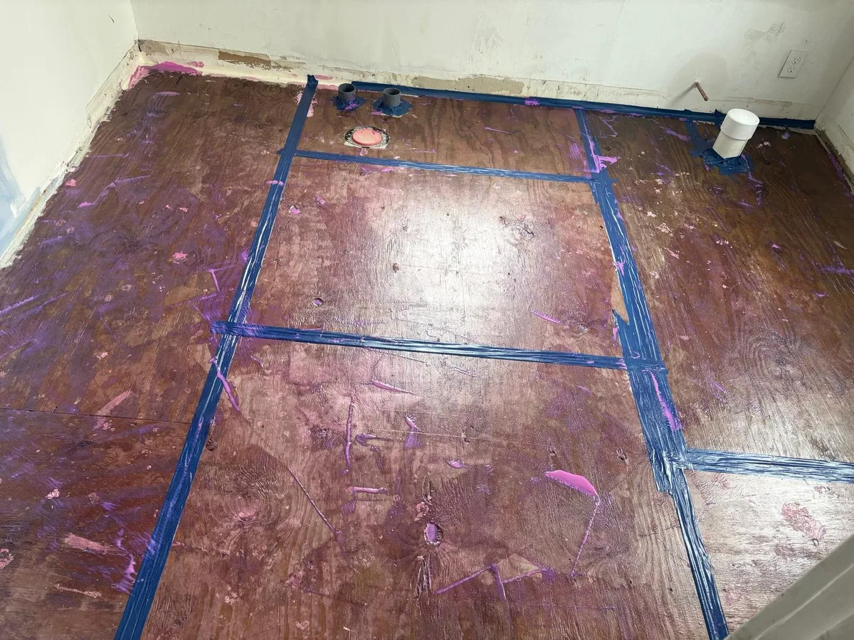 Original wood subfloor prepared and taped