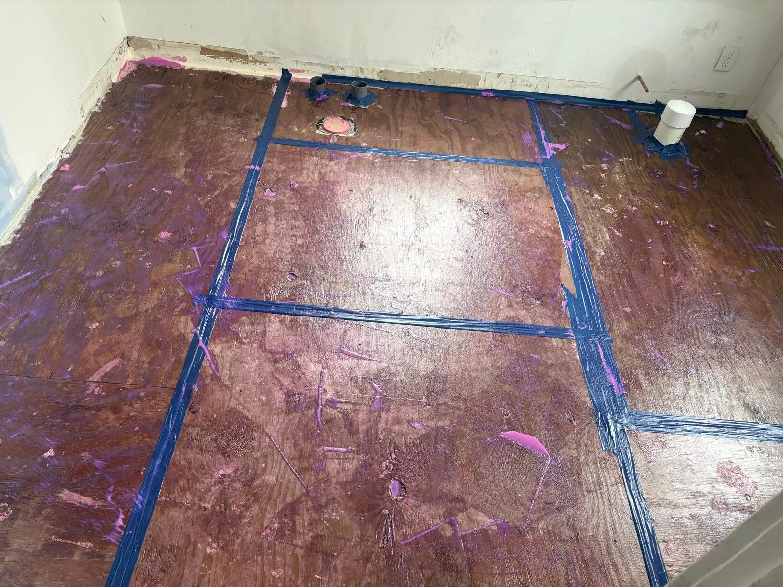 Original wood subfloor prepared and taped