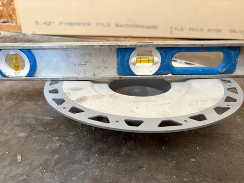 Leveling the shower drain before the mortar bed