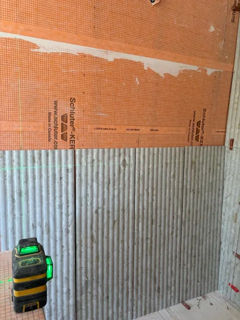 Laser-guided layout for the fluted wall tile