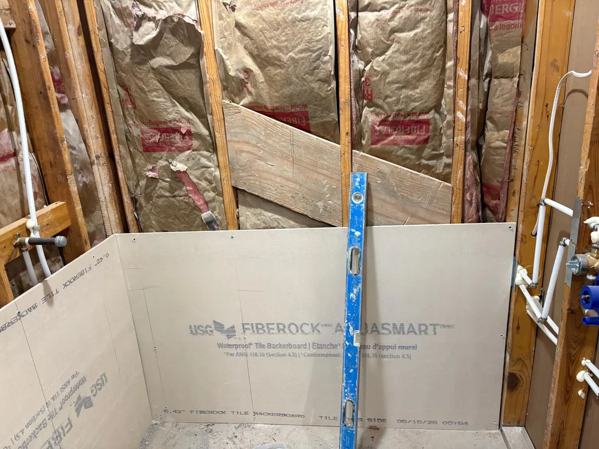Waterproof Fiberock backer board, checked with a level