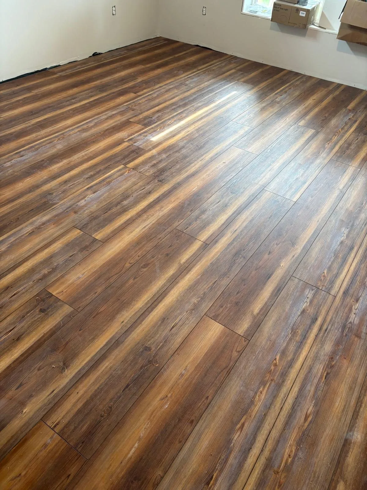 Vinyl plank floor across the living area