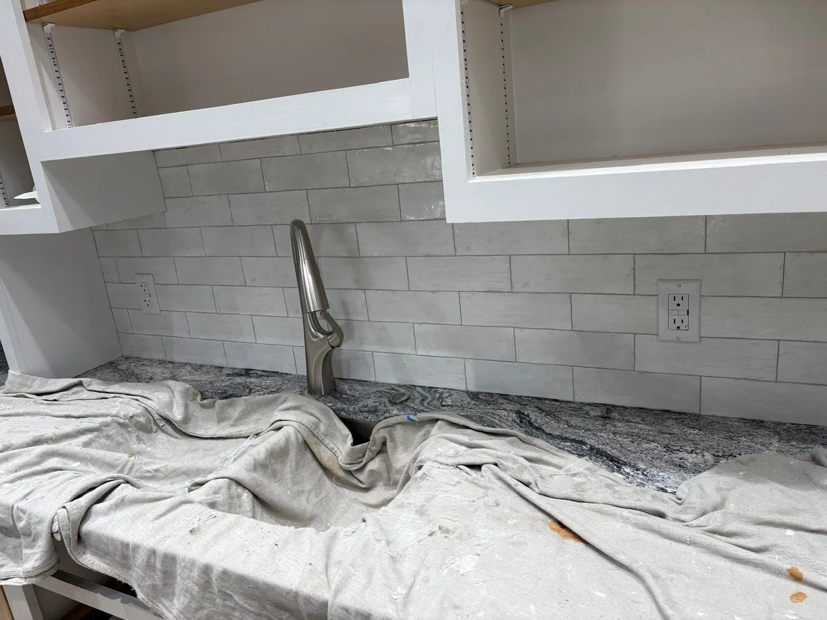 Subway-style backsplash with clean outlet cuts