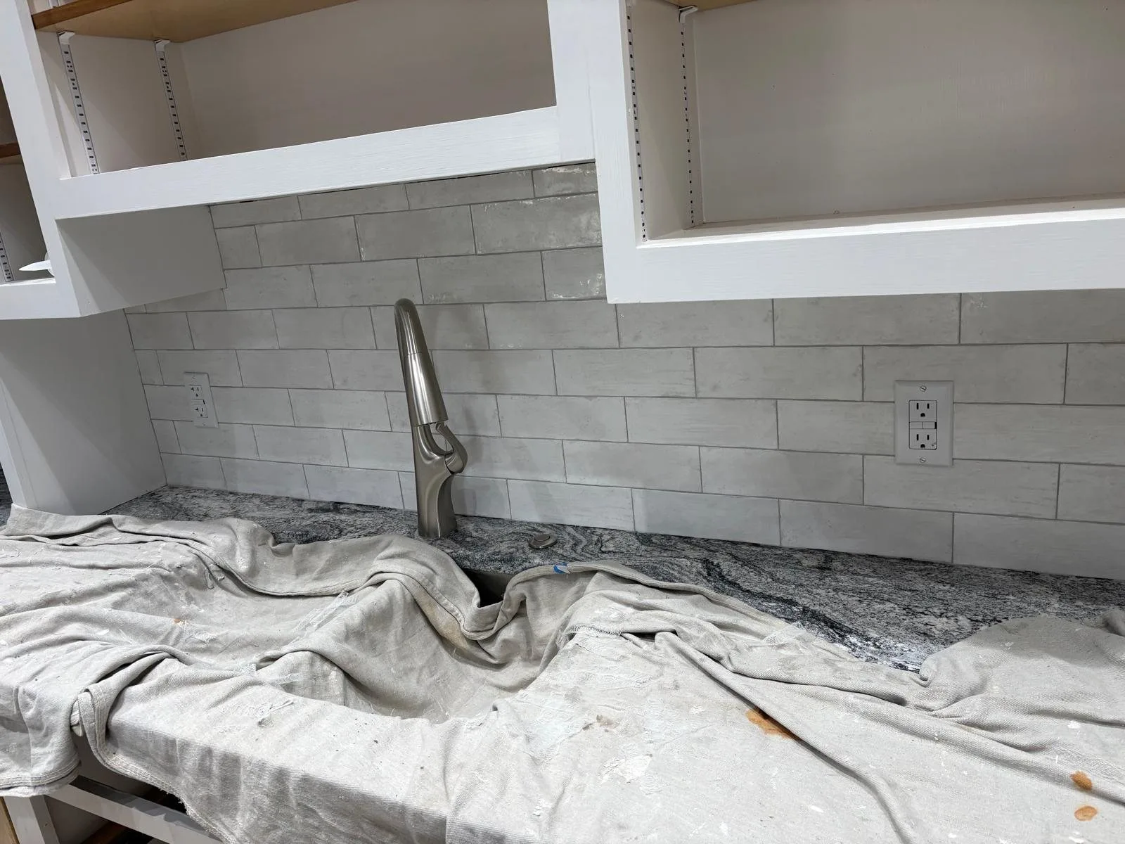 Subway-style backsplash with clean outlet cuts